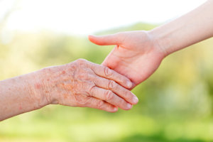 hands on an elderly and an adult